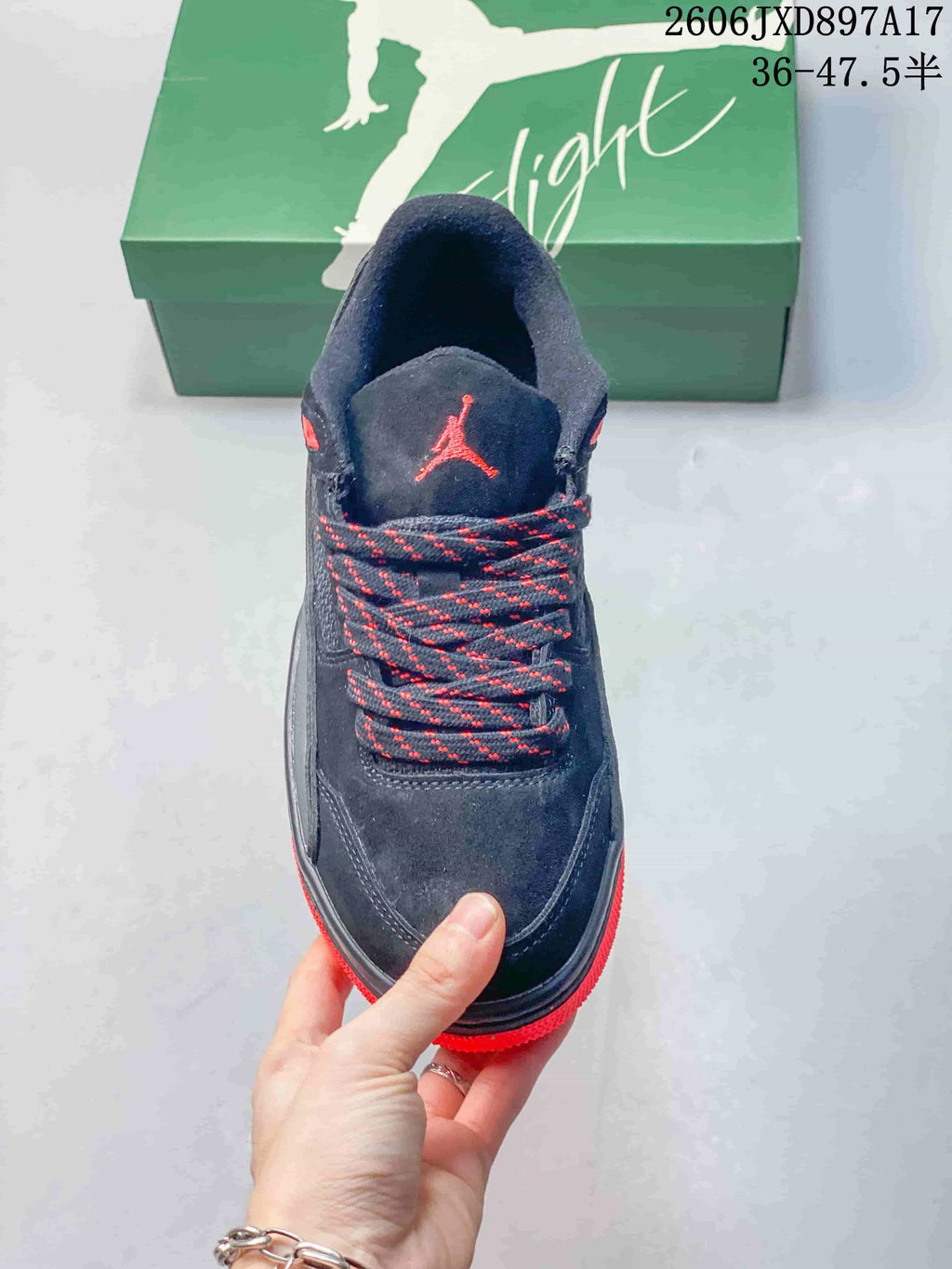 Top view of a dark Jordan Flight Court shoe with red-speckled laces