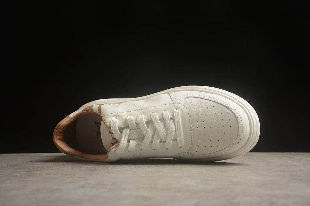 Top view of the sneaker with laces and perforated toe panel