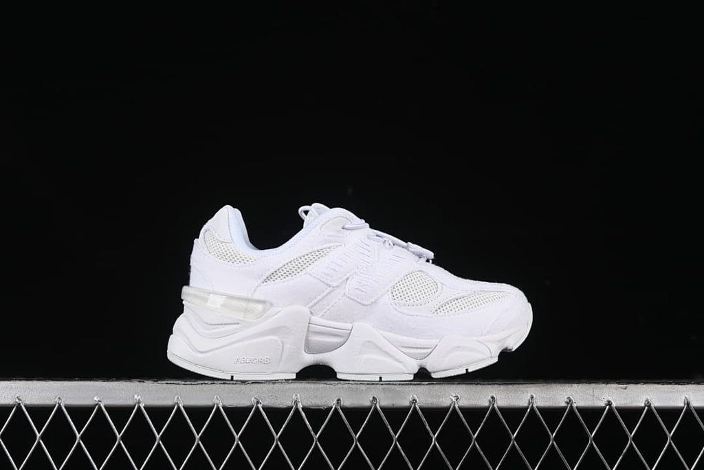 White sneaker shown in side profile.