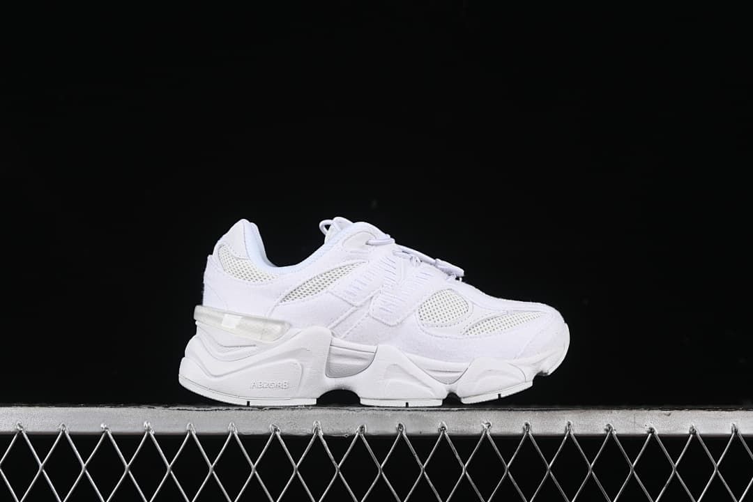 White sneaker shown in side profile.