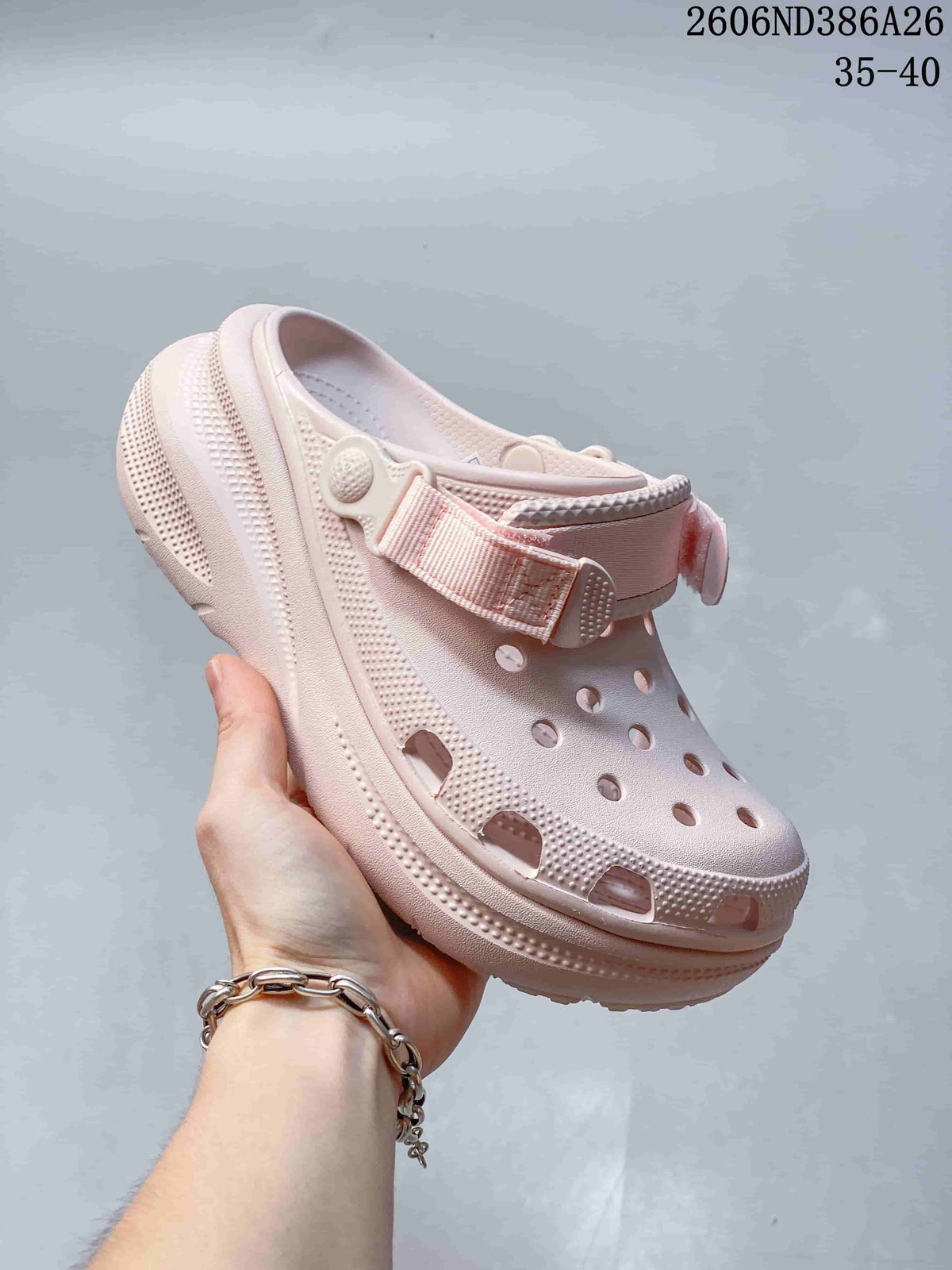 Pale pink perforated clog sandal with adjustable heel strap