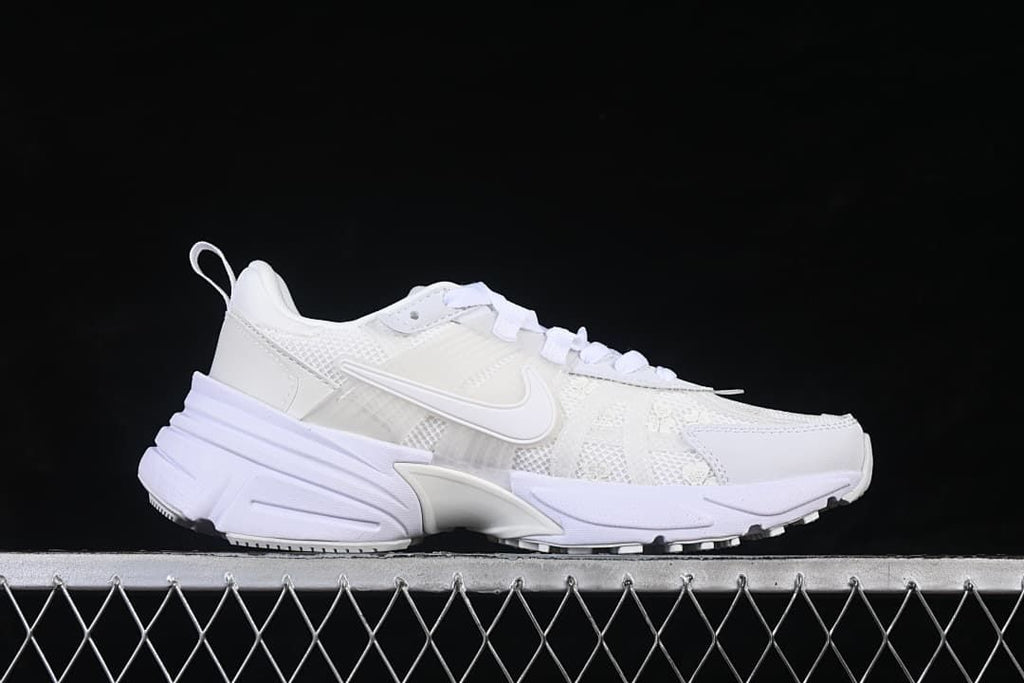 Side profile of the white sneaker with a sculpted sole
