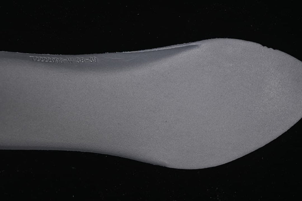 Close-up of the shoe insole showing a printed code and size marking