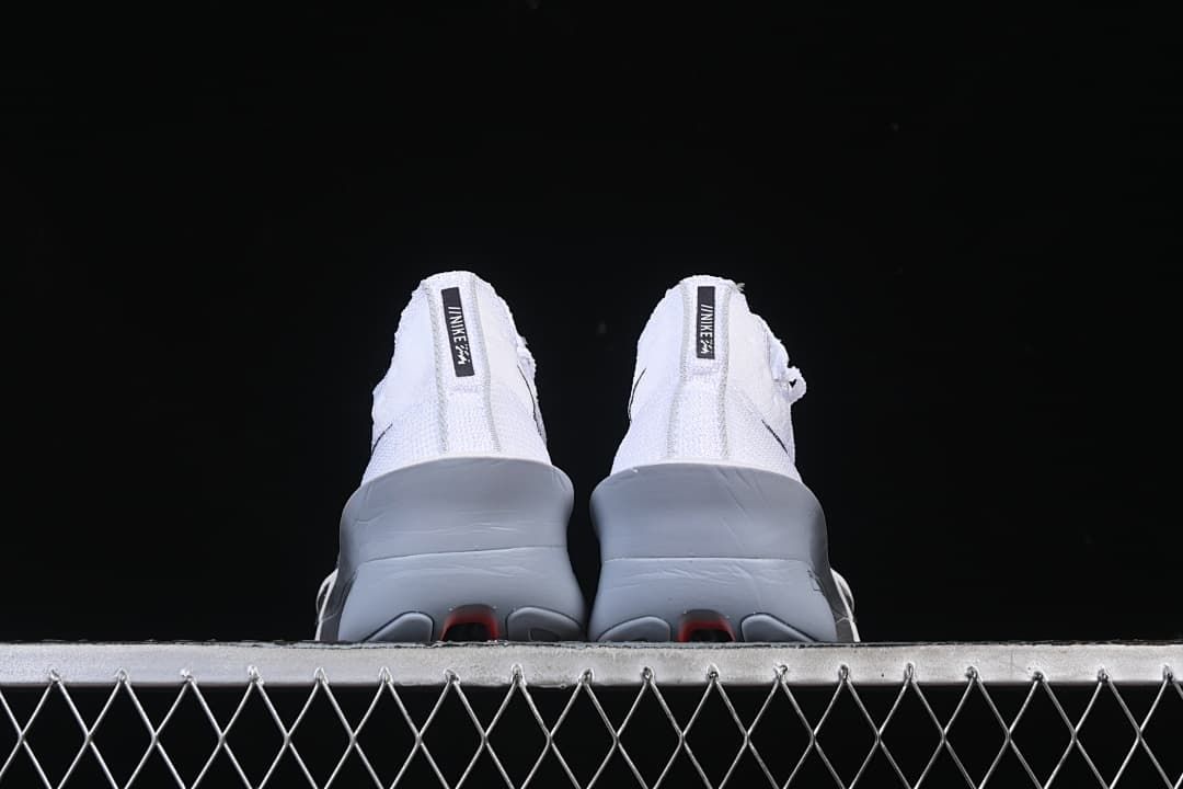 Rear view of both shoes showing their sculpted heels and soles