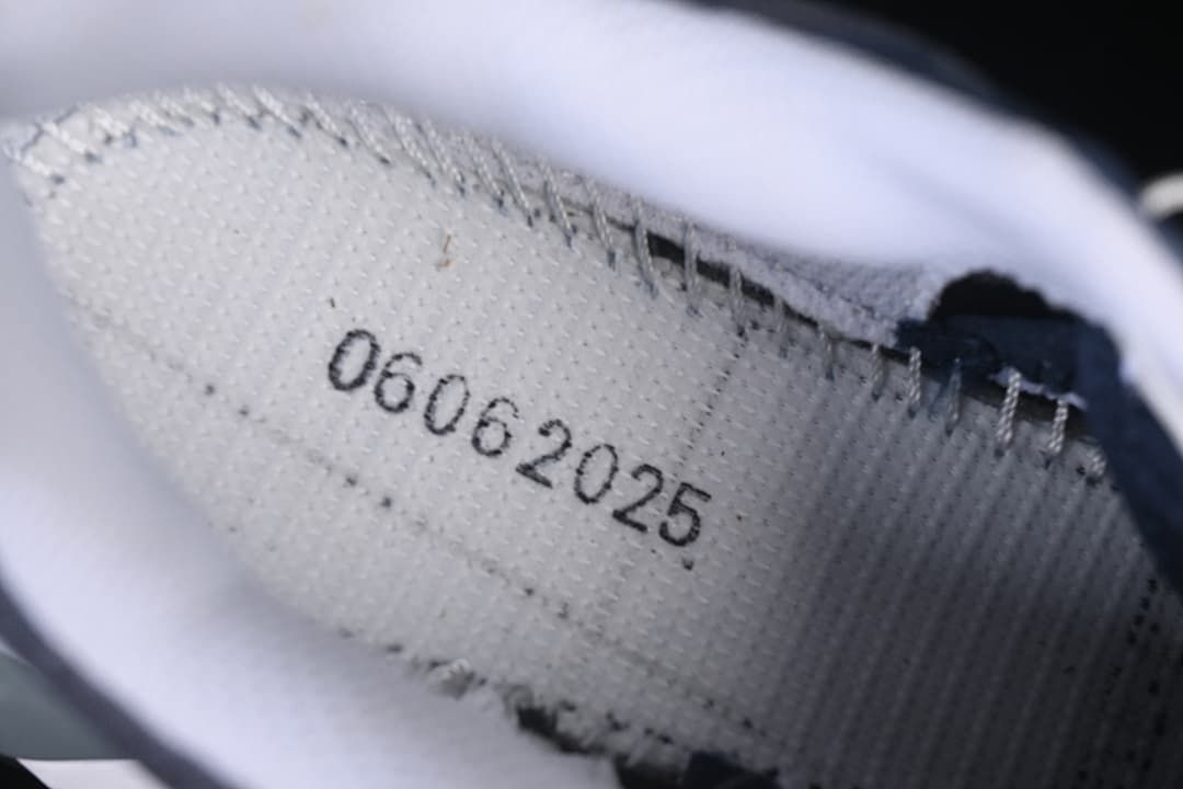 Close-up of an interior shoe label with a printed code.