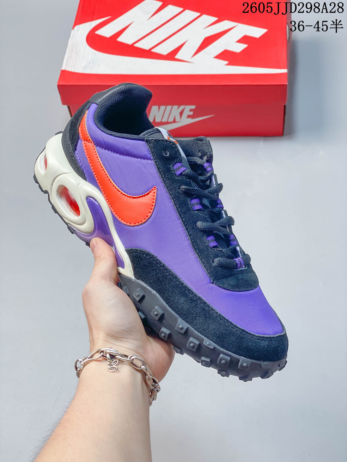 Purple and orange Nike Air Max Waffle SP low-top sneaker with a dark lugged outsole.