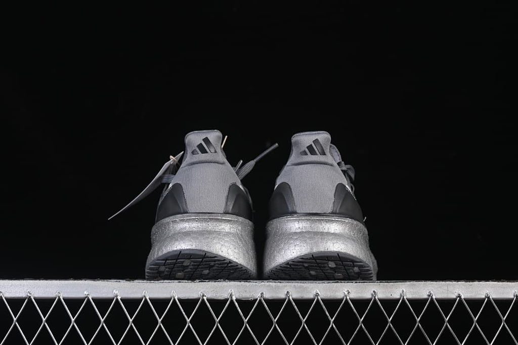 Rear view of the pair showing heel details and outsoles