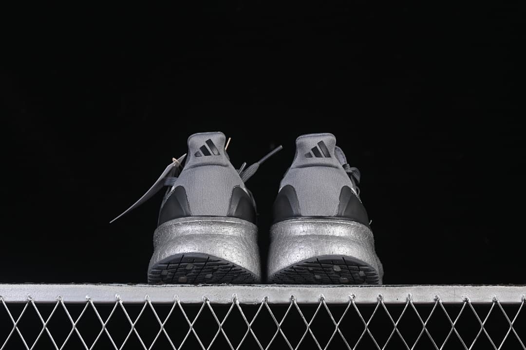 Rear view of the pair showing heel details and outsoles