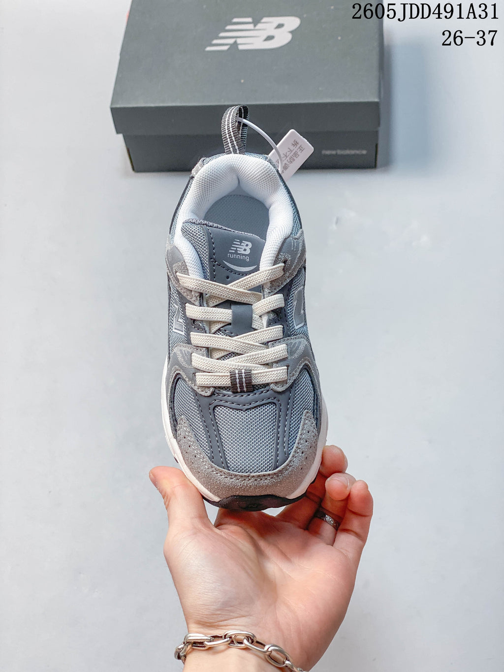 Top view of a gray lace-up kids' sneaker