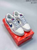 Pair of white and grey Nike SB Dunk Low sneakers with navy and red details, shown on a patterned red box
