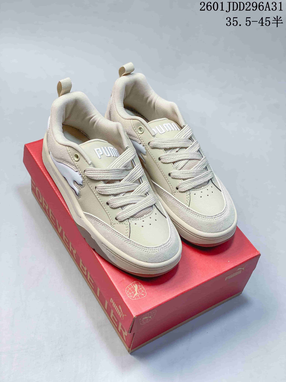 Pair of light neutral PUMA 180 sneakers with pale contrast panels