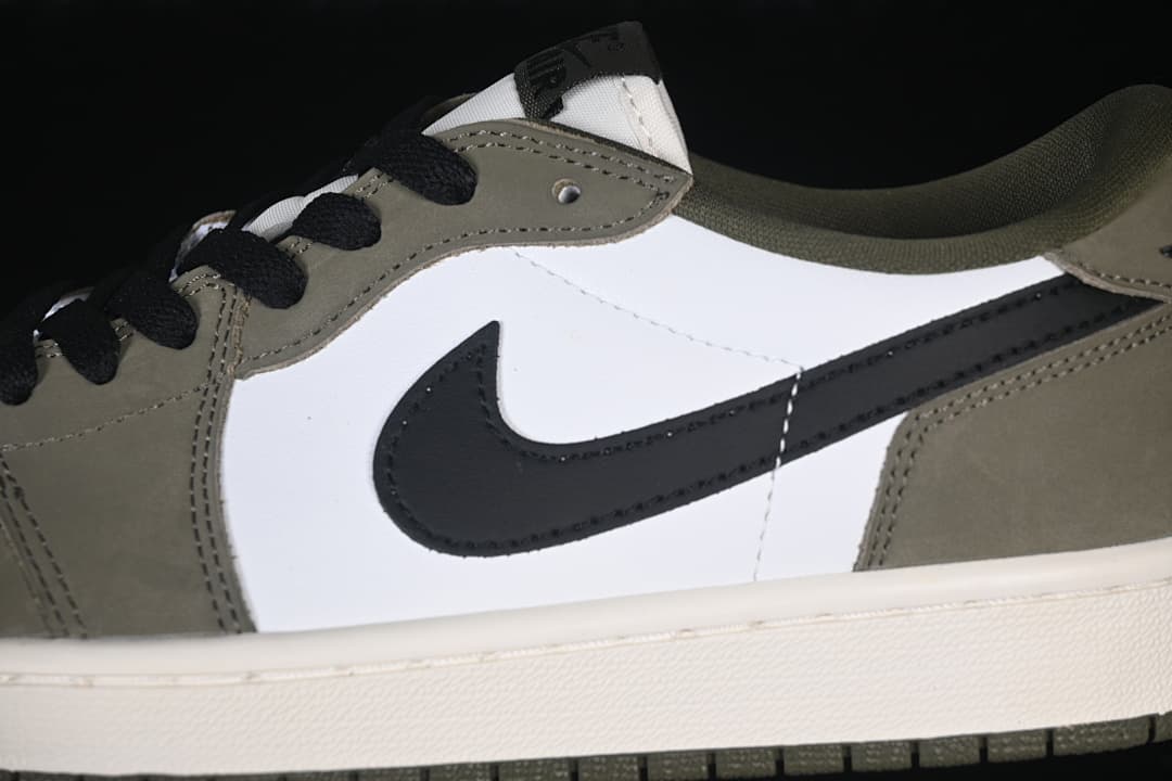 Close-up of the white side panel, black Swoosh, olive overlays, and laces