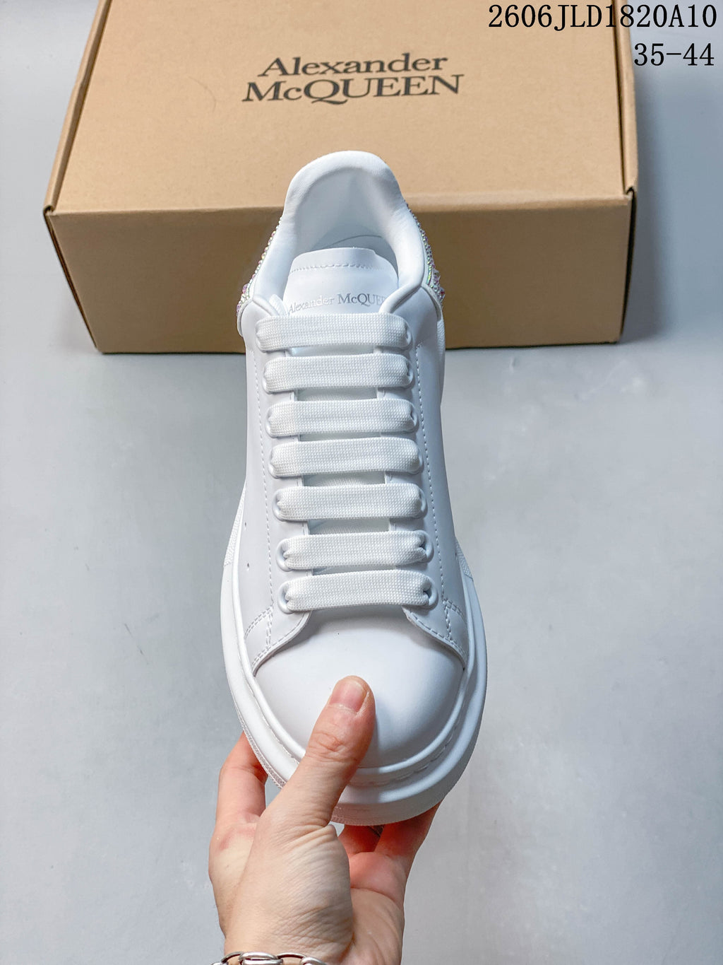 Front view of a white lace-up platform sneaker