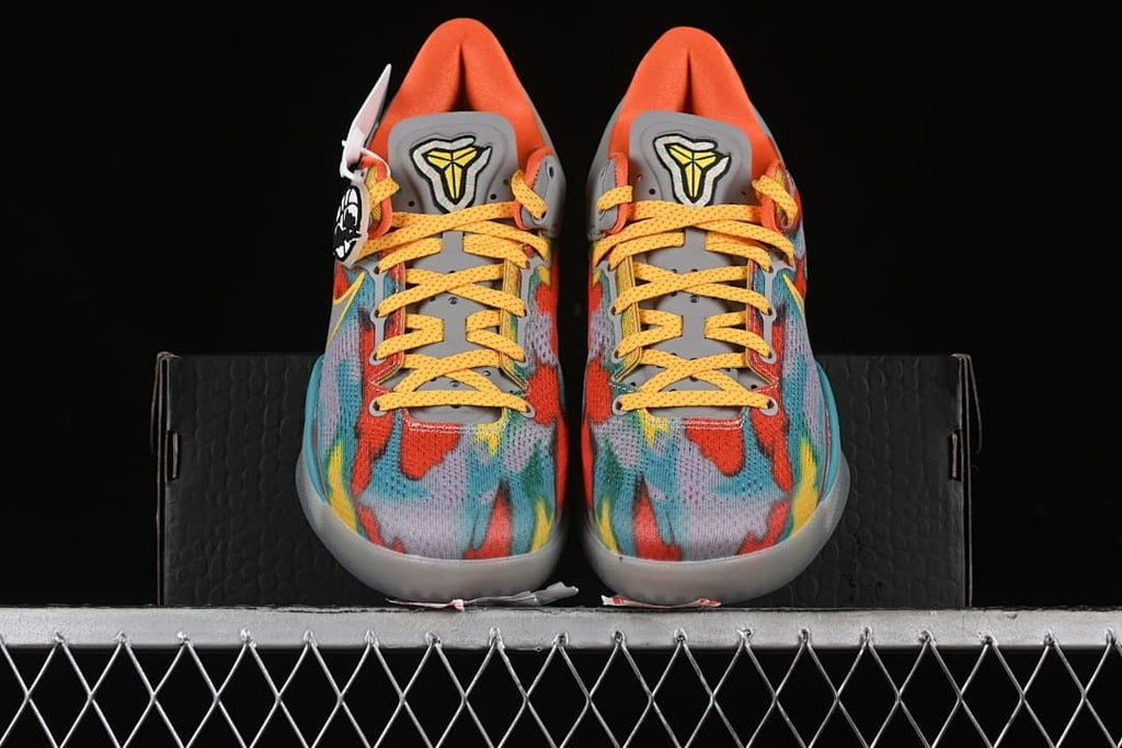 Front view of the pair showing the patterned uppers and yellow laces
