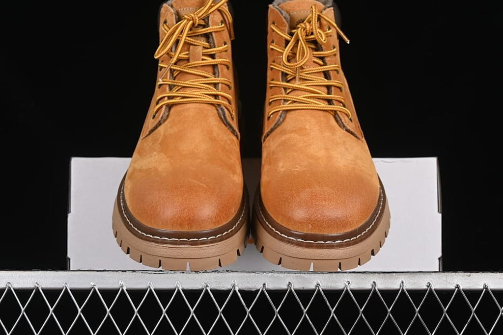 Front view of the pair showing rounded toes, laces, and lugged soles.