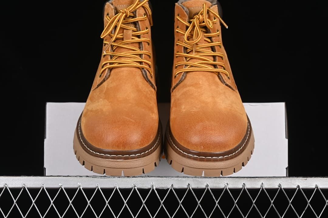 Front view of the pair showing rounded toes, laces, and lugged soles.