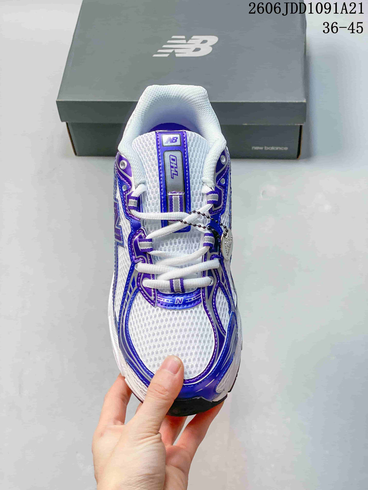Top view of a white and blue-purple New Balance 740 sneaker