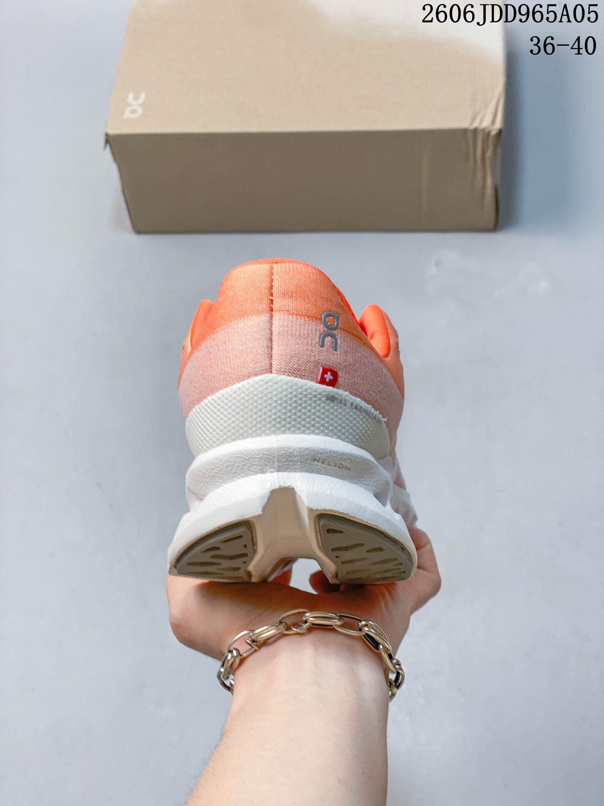 Rear view showing the coral heel and sculpted white sole