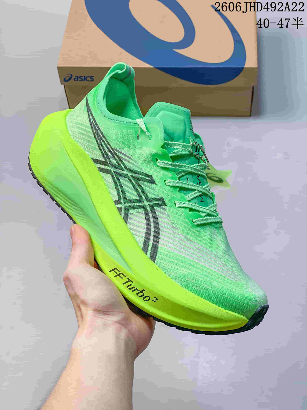 Side view of a bright green ASICS MEGABLAST shoe showing its patterned upper and thick midsole
