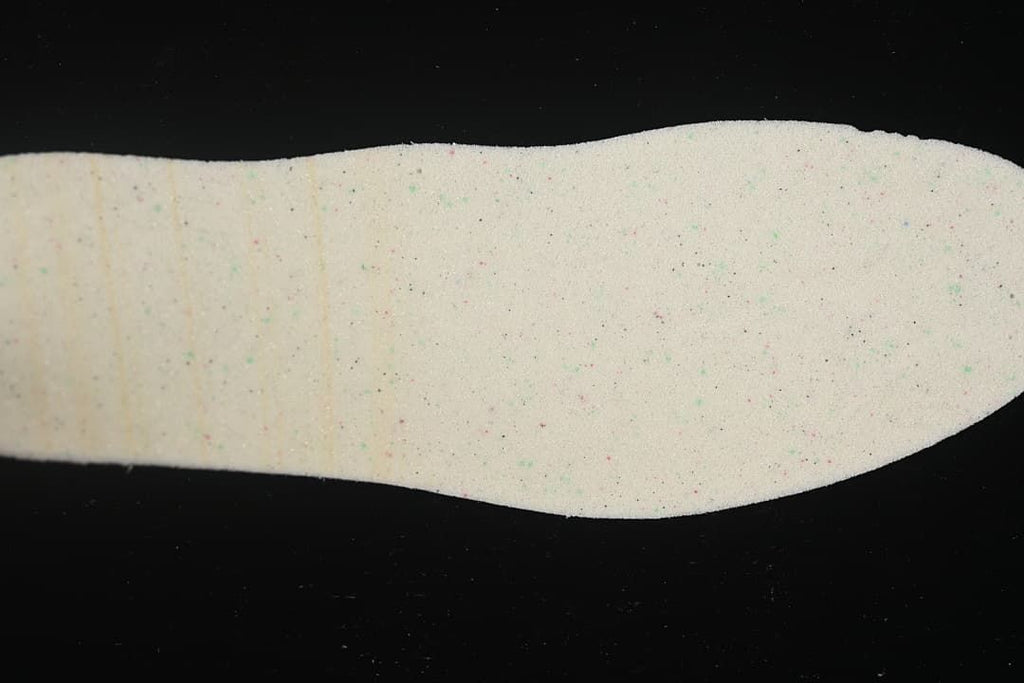 Light-colored shoe insert shown by itself.