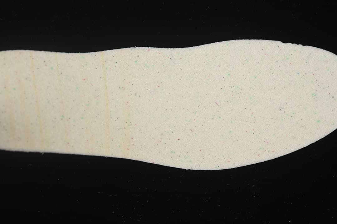 Light-colored shoe insert shown by itself.