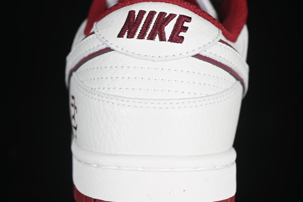 Rear view showing Nike heel tab and burgundy accents