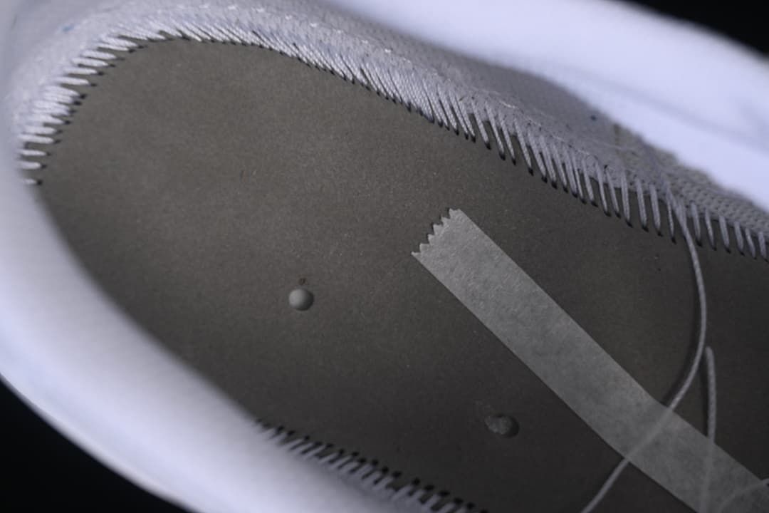 Close-up view inside the shoe showing stitching and interior construction