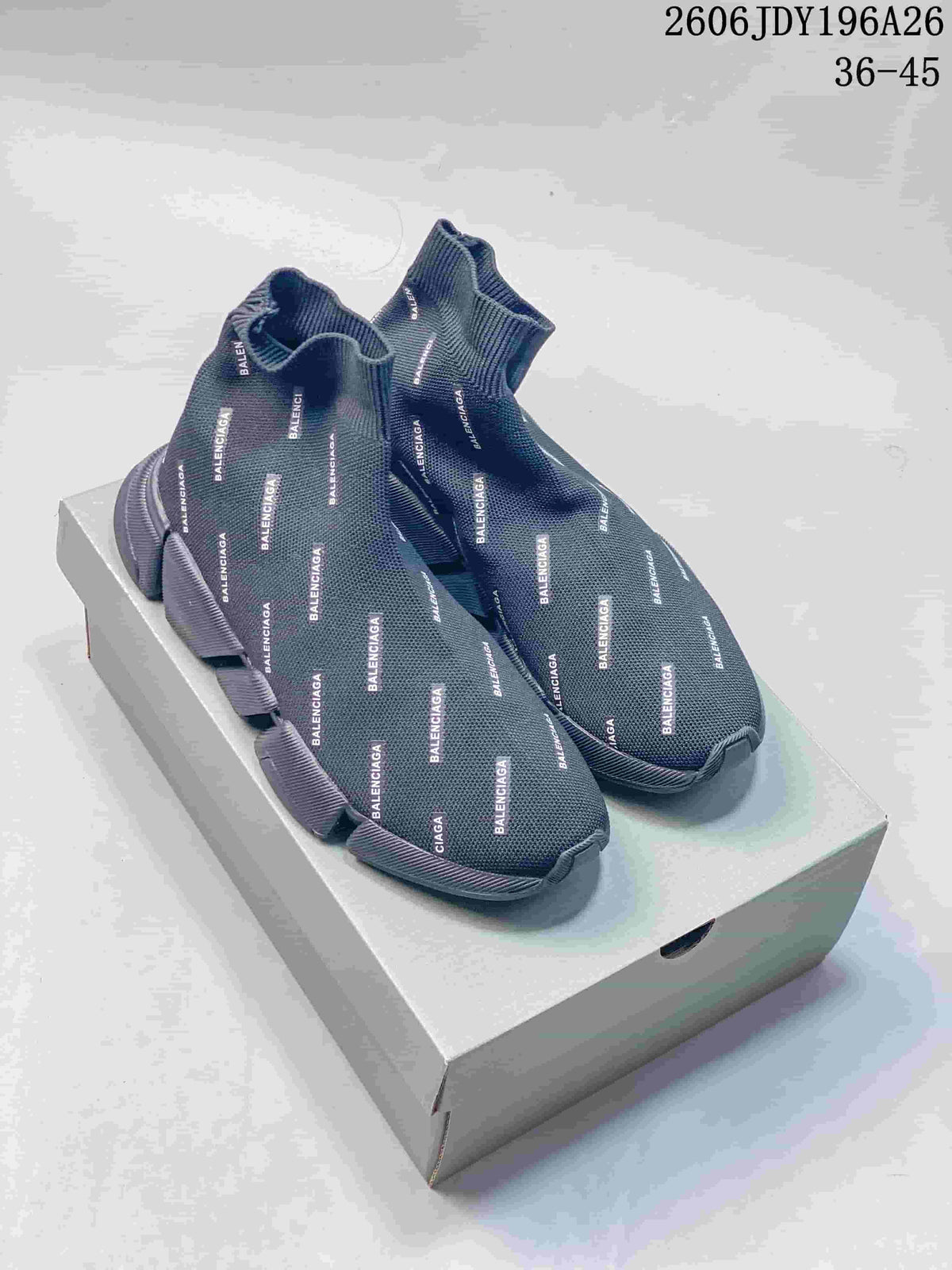 Dark gray sock-style sneakers with repeated Balenciaga branding and segmented sole, pictured on a box.