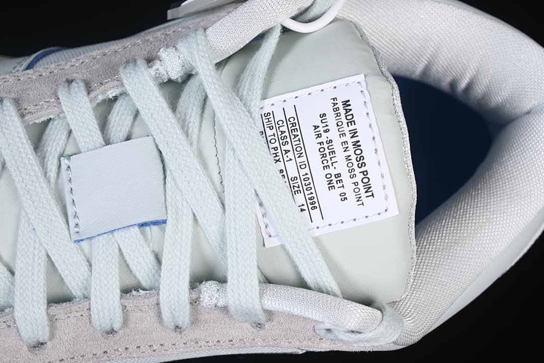 Close-up of the shoe tongue label and pale laces