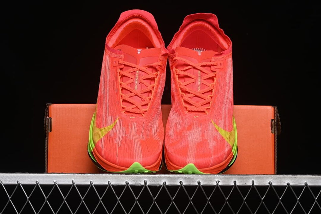 Front view of the pair displayed against an orange shoebox.