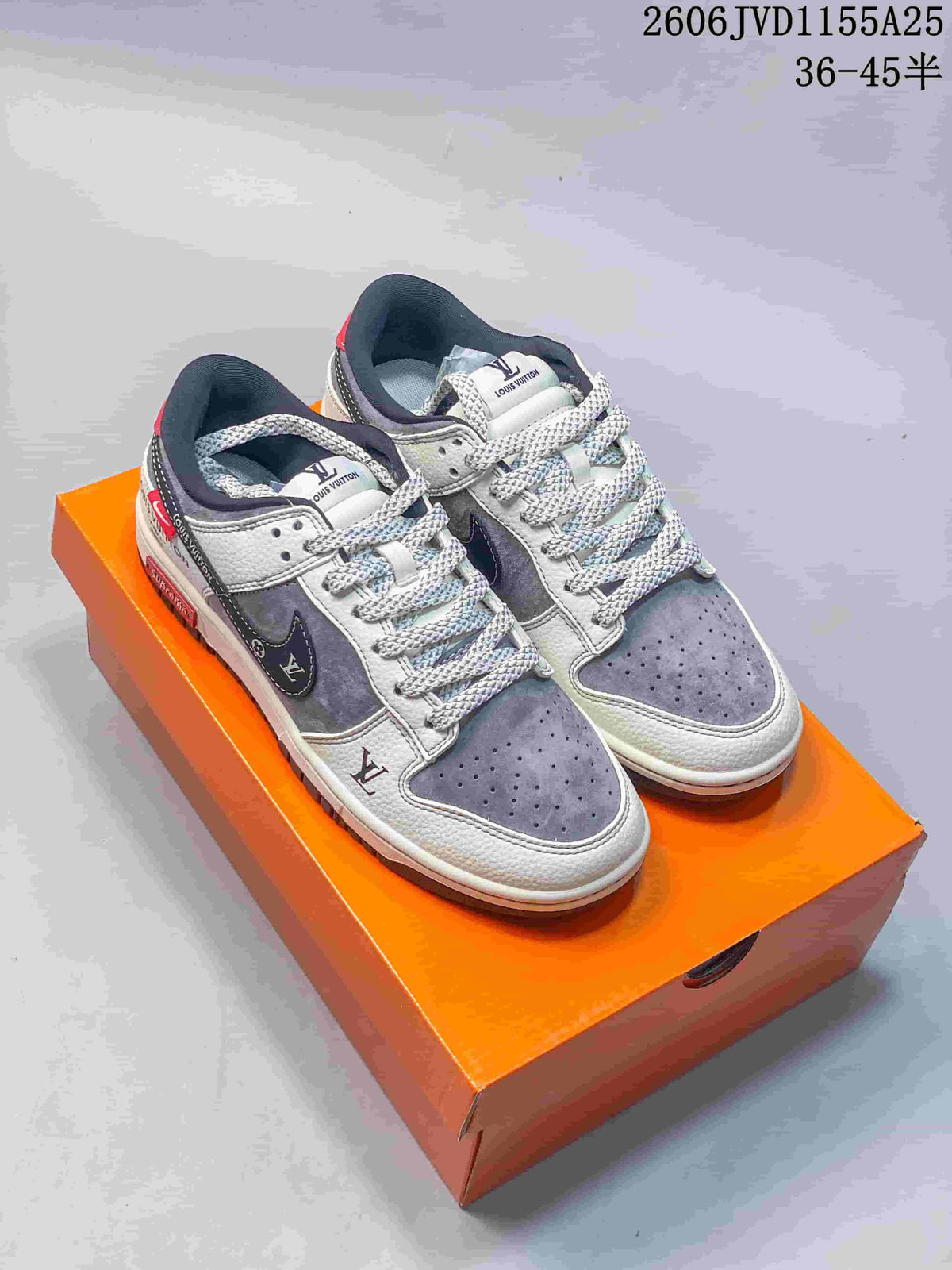 Pair of gray and white low-top sneakers with contrasting overlays and patterned laces