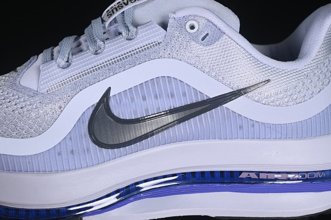 Close-up of side Swoosh and layered upper panels