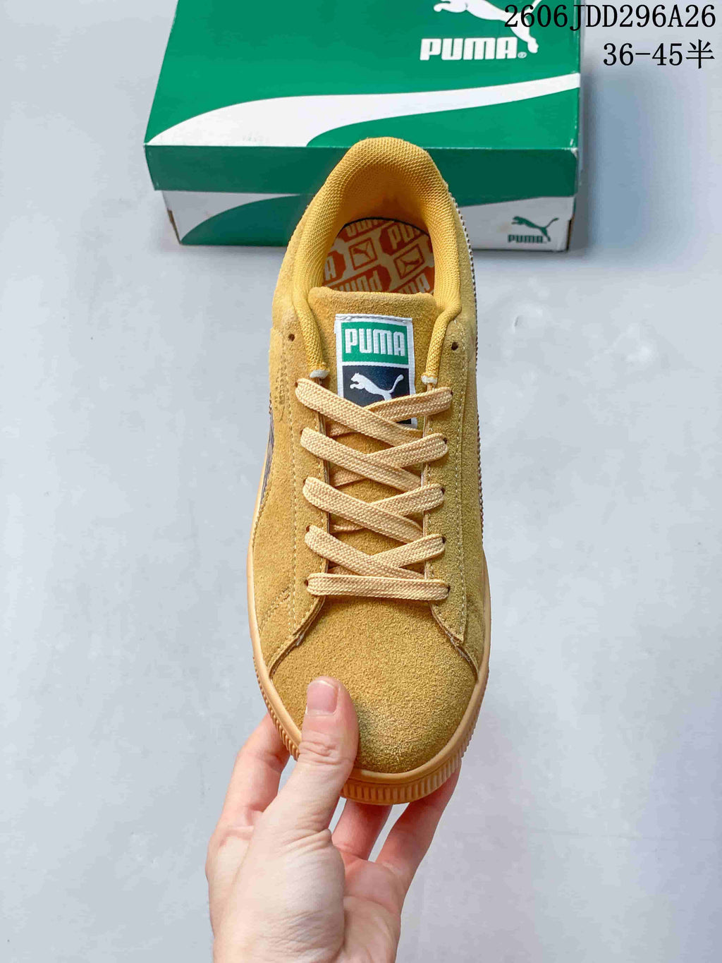 Top view of the lace-up sneaker with its branded tongue and patterned insole