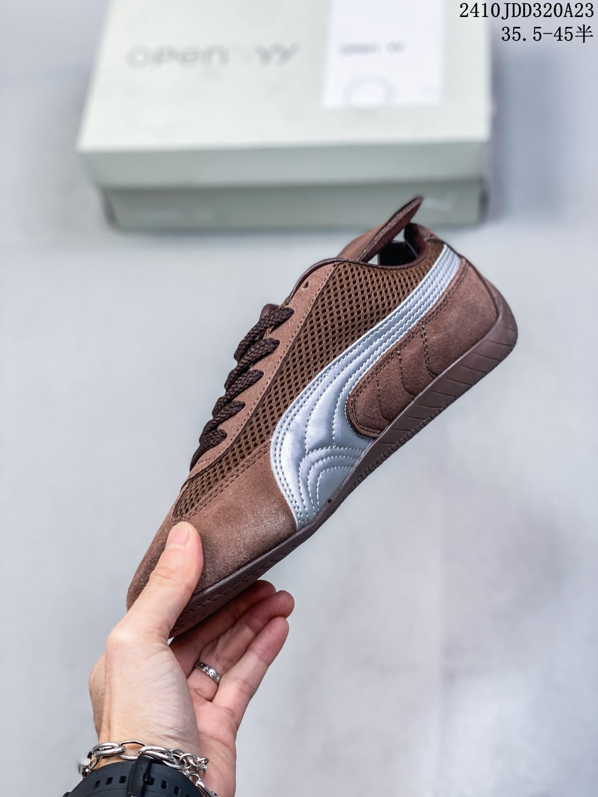 Side view showing the silver stripe and low-profile shape of the brown Puma Speedcat