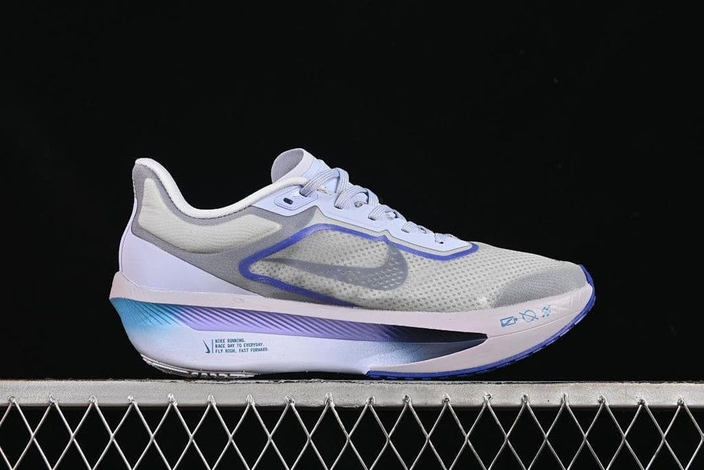 Outer side view of one shoe with gray, blue, and white details.