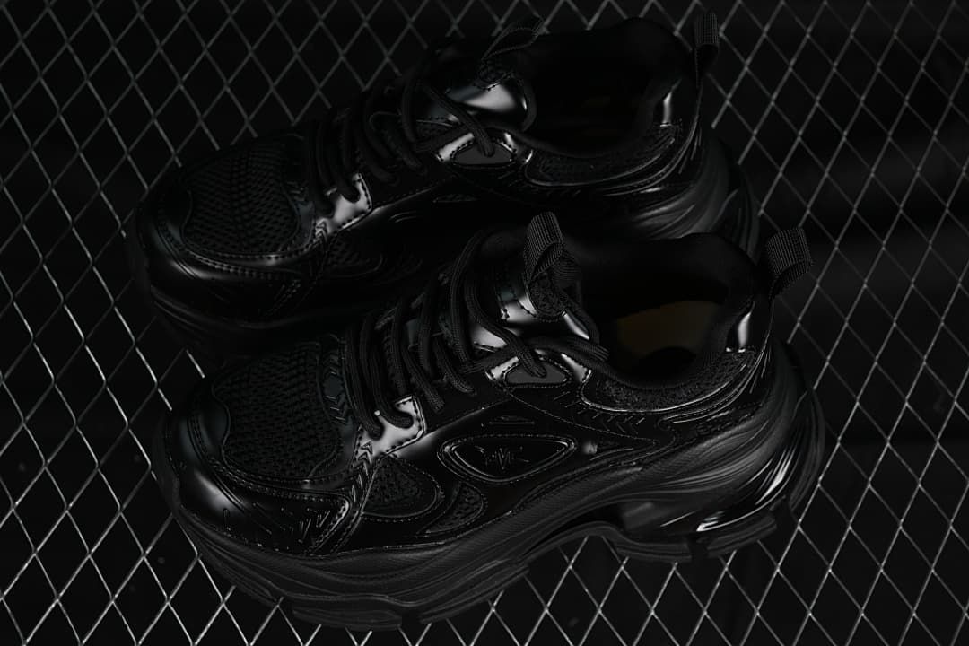 Pair of black chunky sneakers photographed from above at an angle.