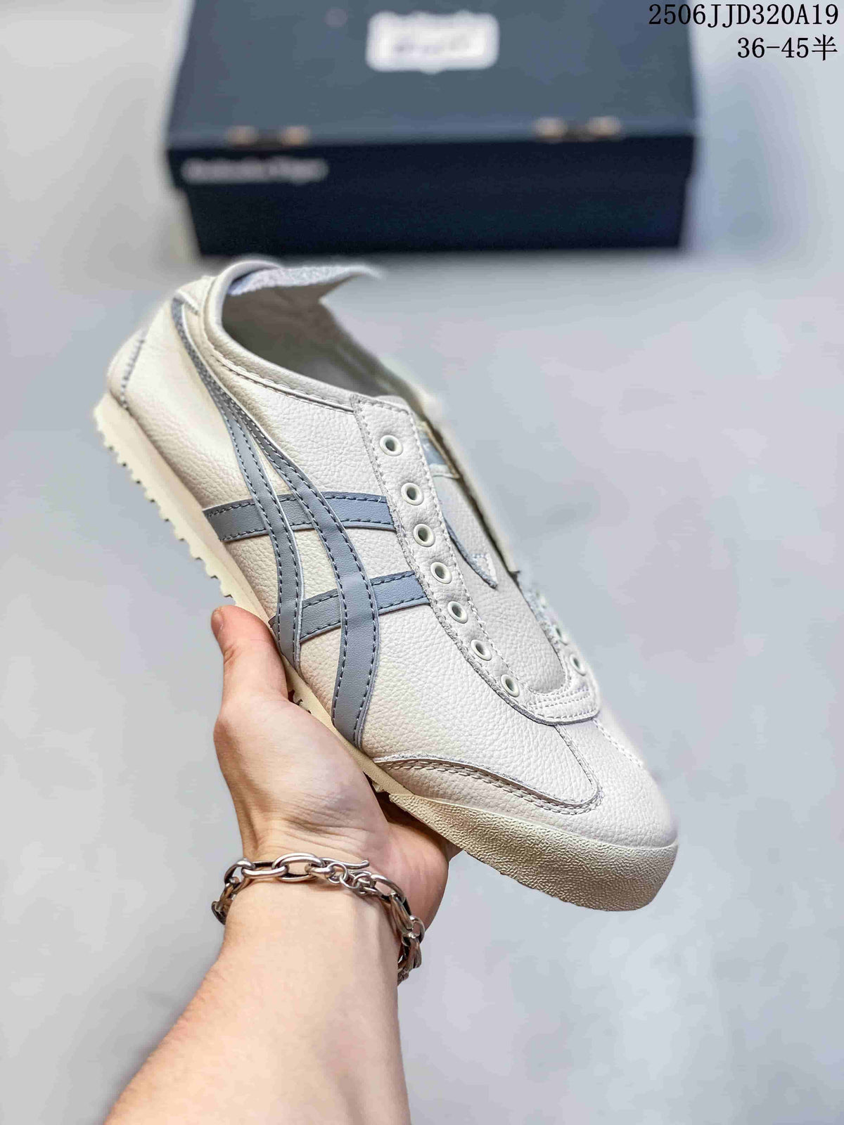 White low-top sneaker with gray side stripes and a light outsole