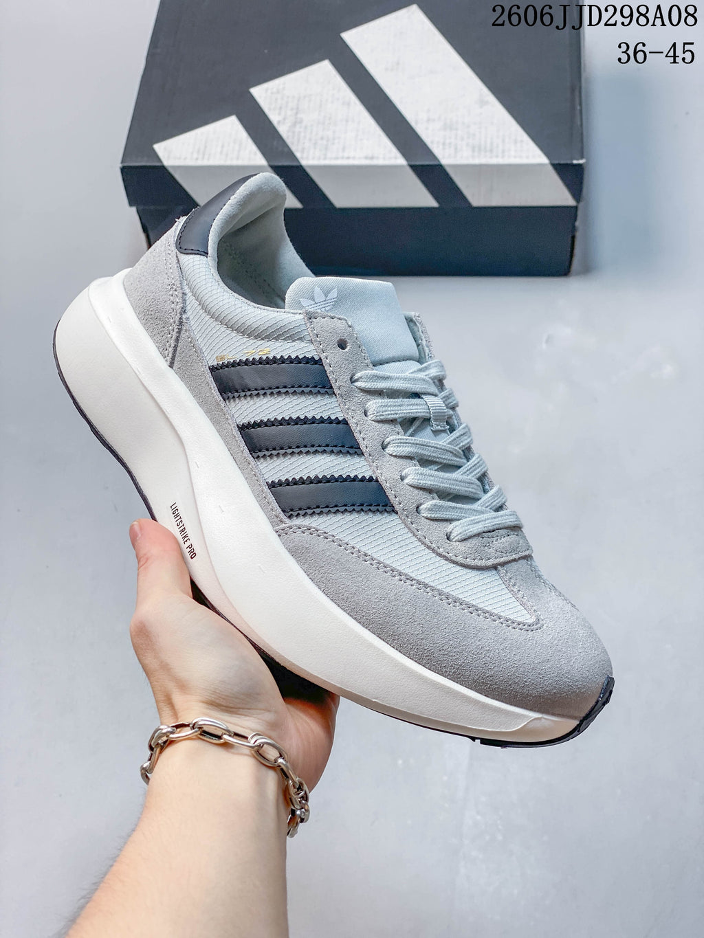 Light grey adidas SL 72 Pro sneaker with dark stripes and a chunky white sole