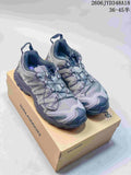 Gray Salomon trail running shoes shown as a pair on a branded box