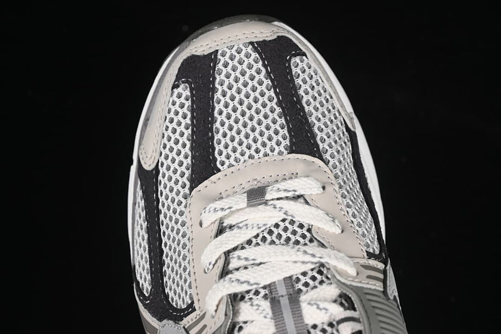 Top-down close-up of the mesh toe and laces.
