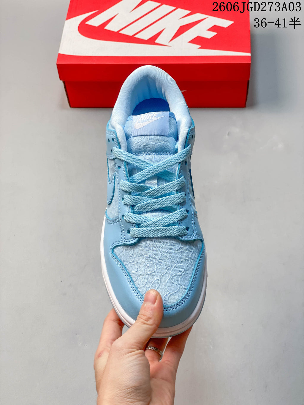Front view showing blue laces and patterned toe panel