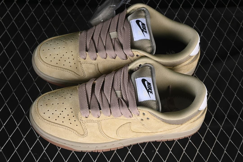 Pair of tan Nike SB Dunk Low Pro B sneakers viewed from above