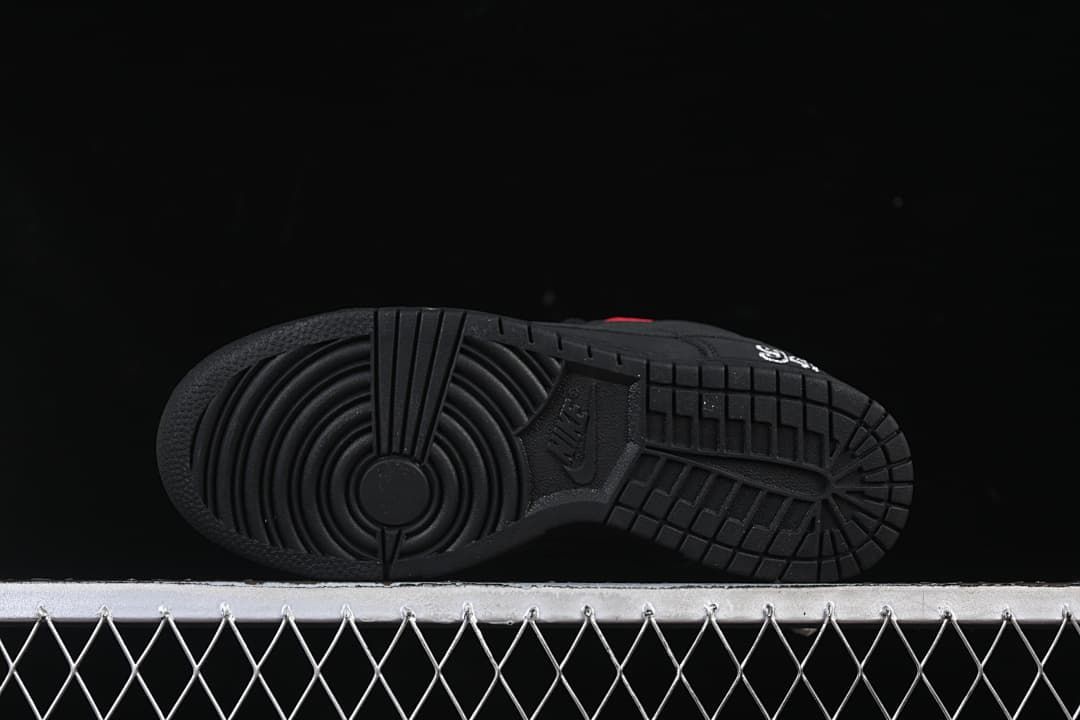 View of the black outsole and circular forefoot tread