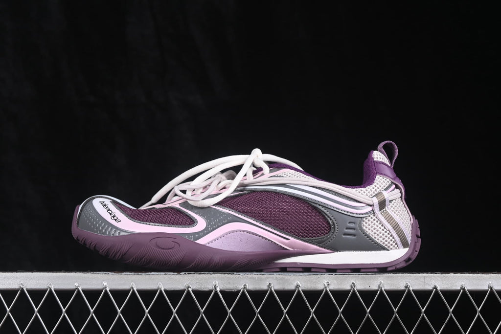 Side profile of a purple and pink Balenciaga Radar sneaker with mesh panels, layered detailing, and a white midsole.
