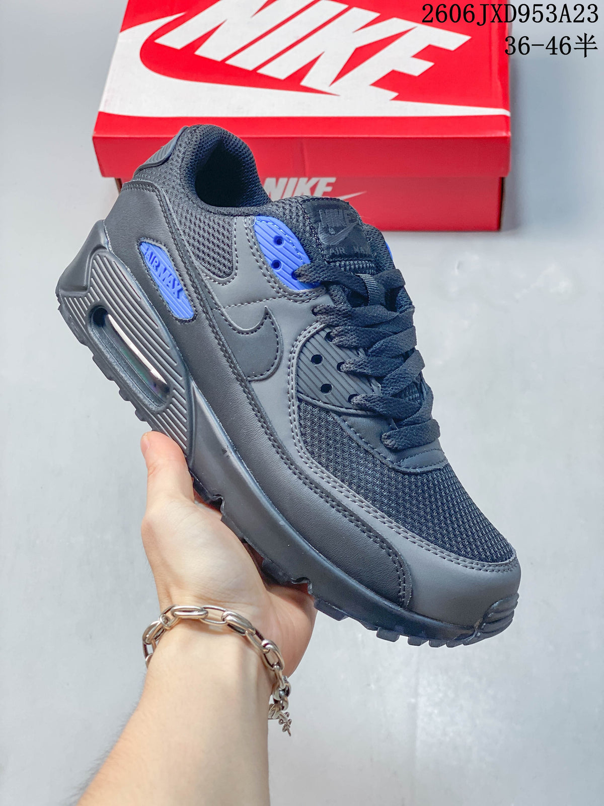 Charcoal Nike Air Max 90 sneaker with blue accents