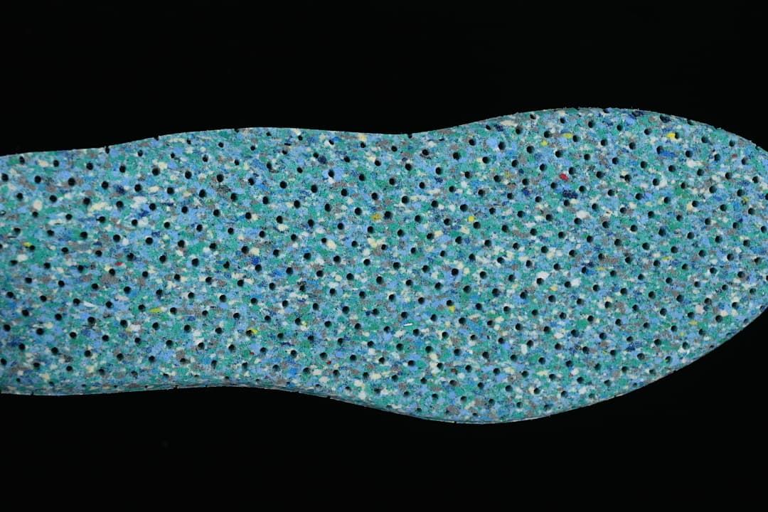 Close-up of a blue-green textured shoe insert