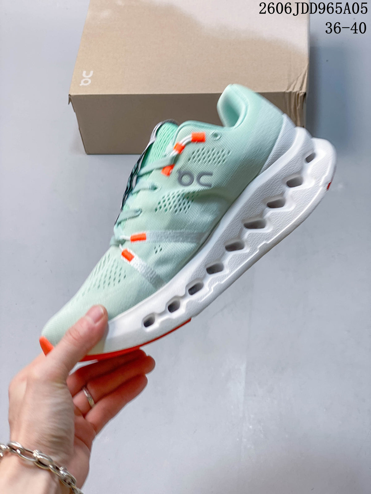 Side profile showing the mint upper and sculpted white sole