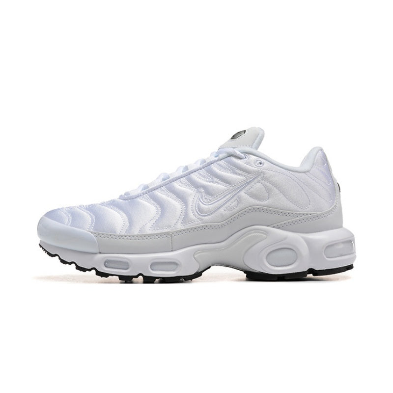 White Nike Air Max Plus sneaker with tonal layered panels.