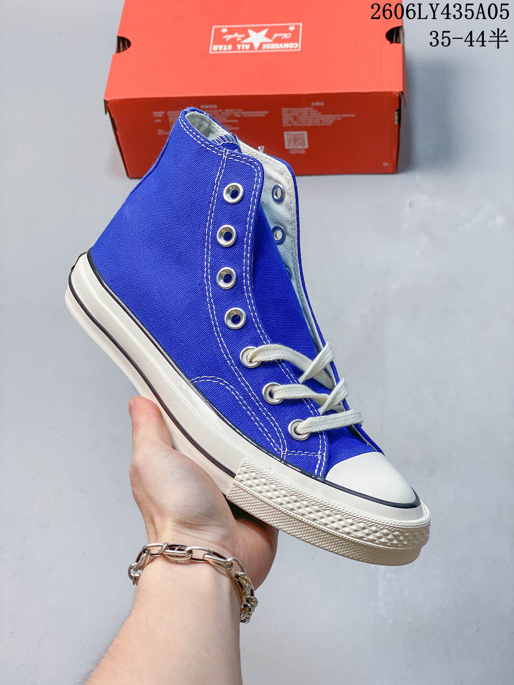 Side view of a blue Converse Chuck Taylor 1970s-style high-top sneaker