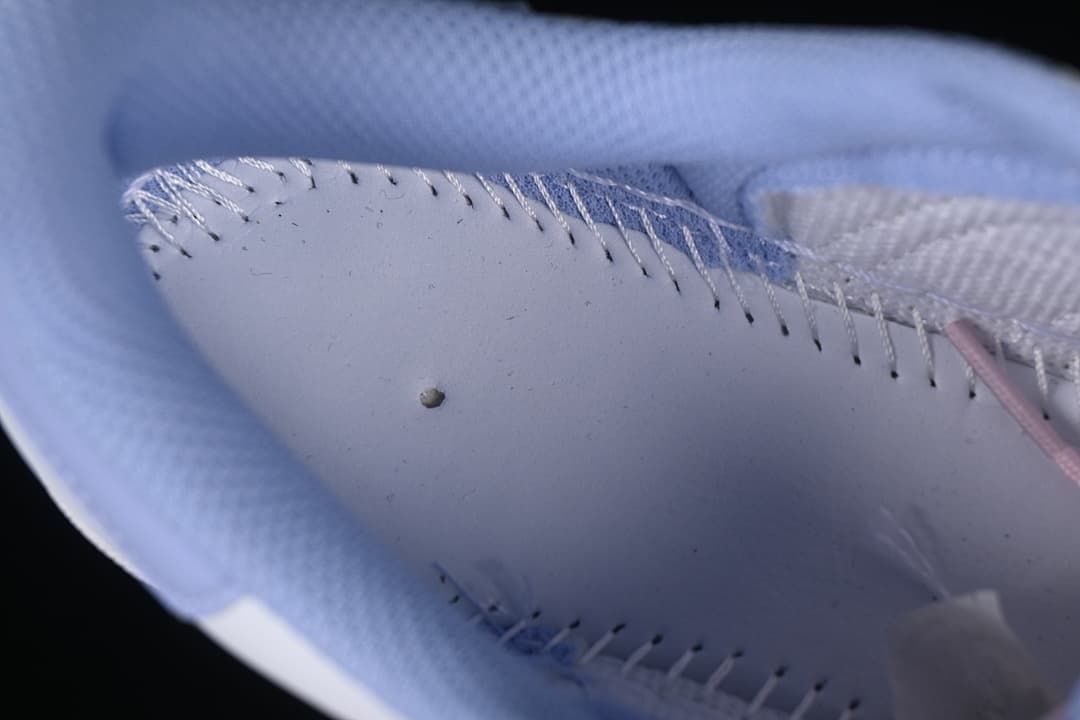 Close-up of the lavender padded interior and stitching